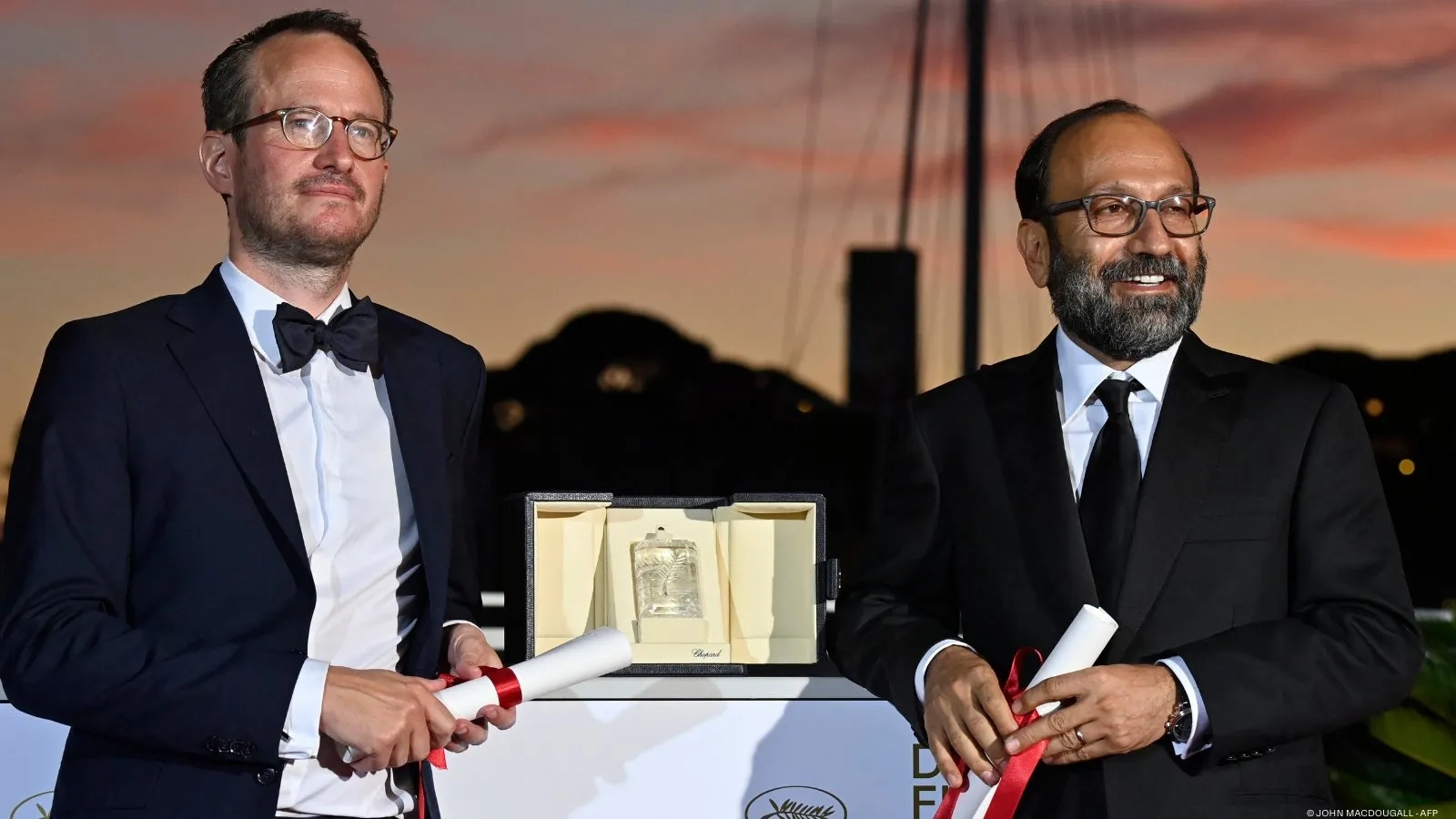 Asghar Farhadi and Juho Kuosmanen at an event for A Hero (2021)