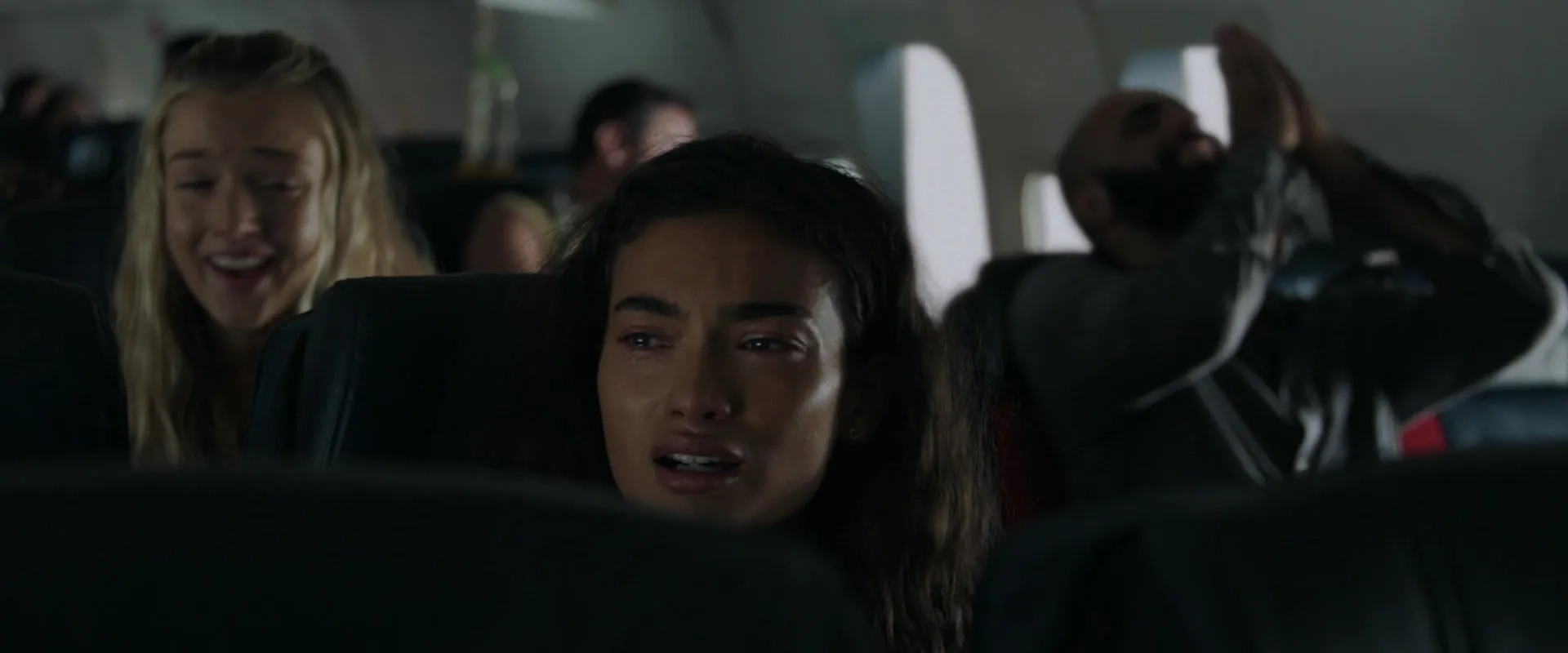 Lilly Krug, Kelly Gale, and Angel Fabián Rivera in Plane (2023)