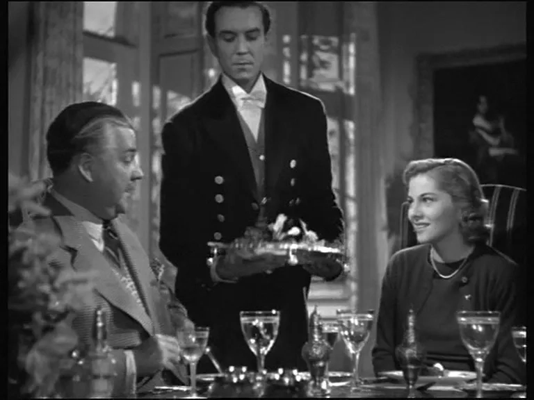 Joan Fontaine, Nigel Bruce, and Philip Winter in Rebecca (1940)