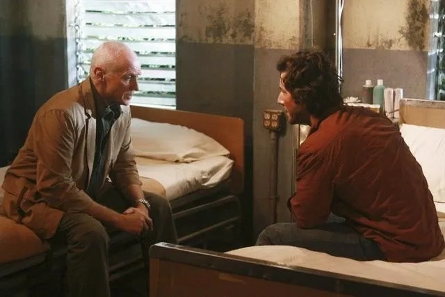 Henry Ian Cusick and Alan Dale in Lost (2004)