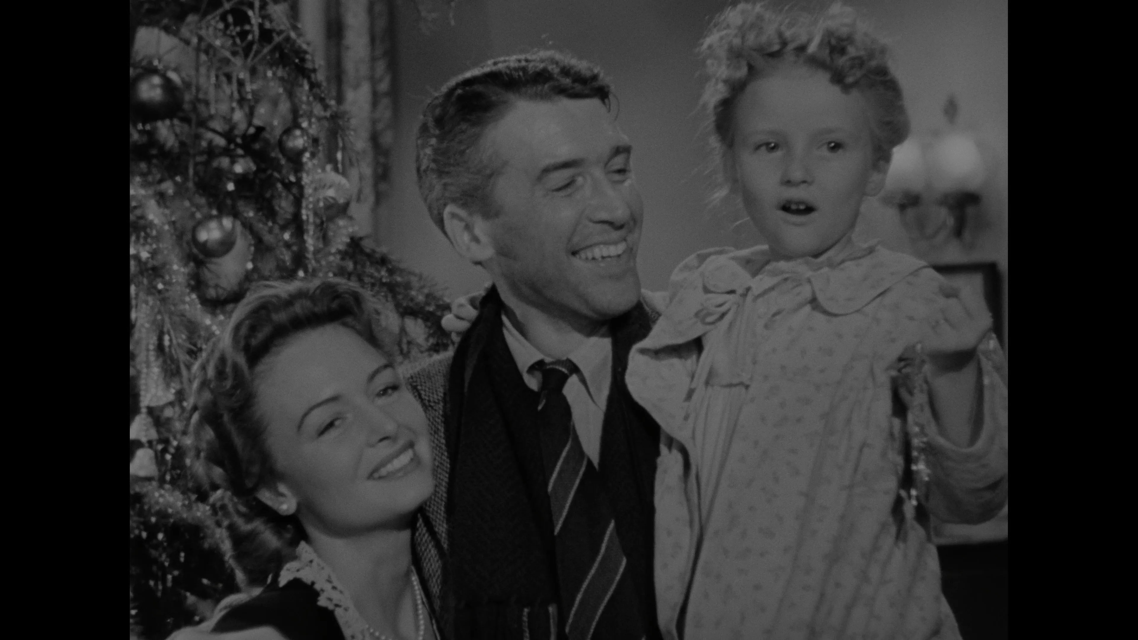 James Stewart, Donna Reed, and Karolyn Grimes in It's a Wonderful Life (1946)