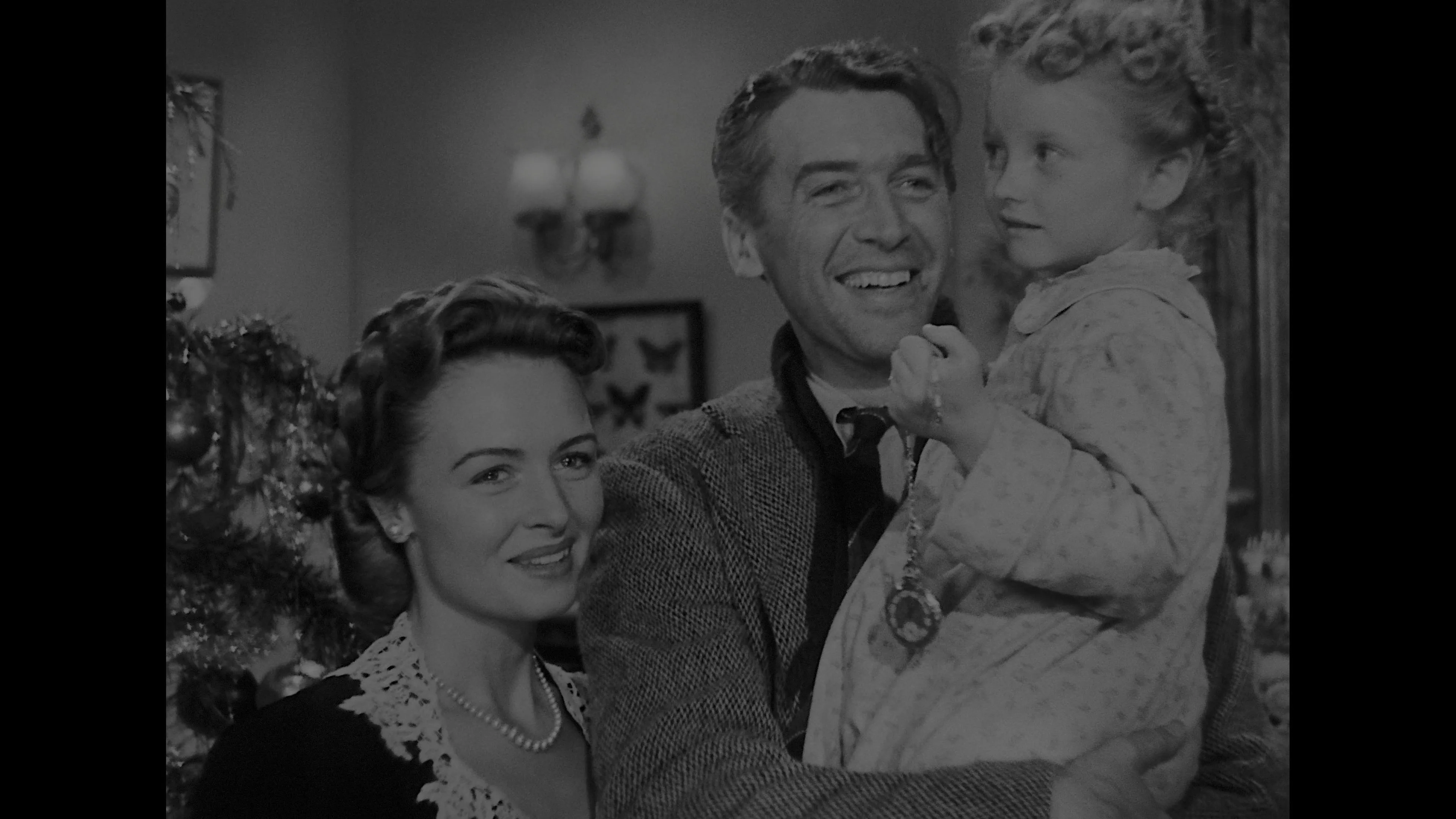 James Stewart, Donna Reed, and Karolyn Grimes in It's a Wonderful Life (1946)