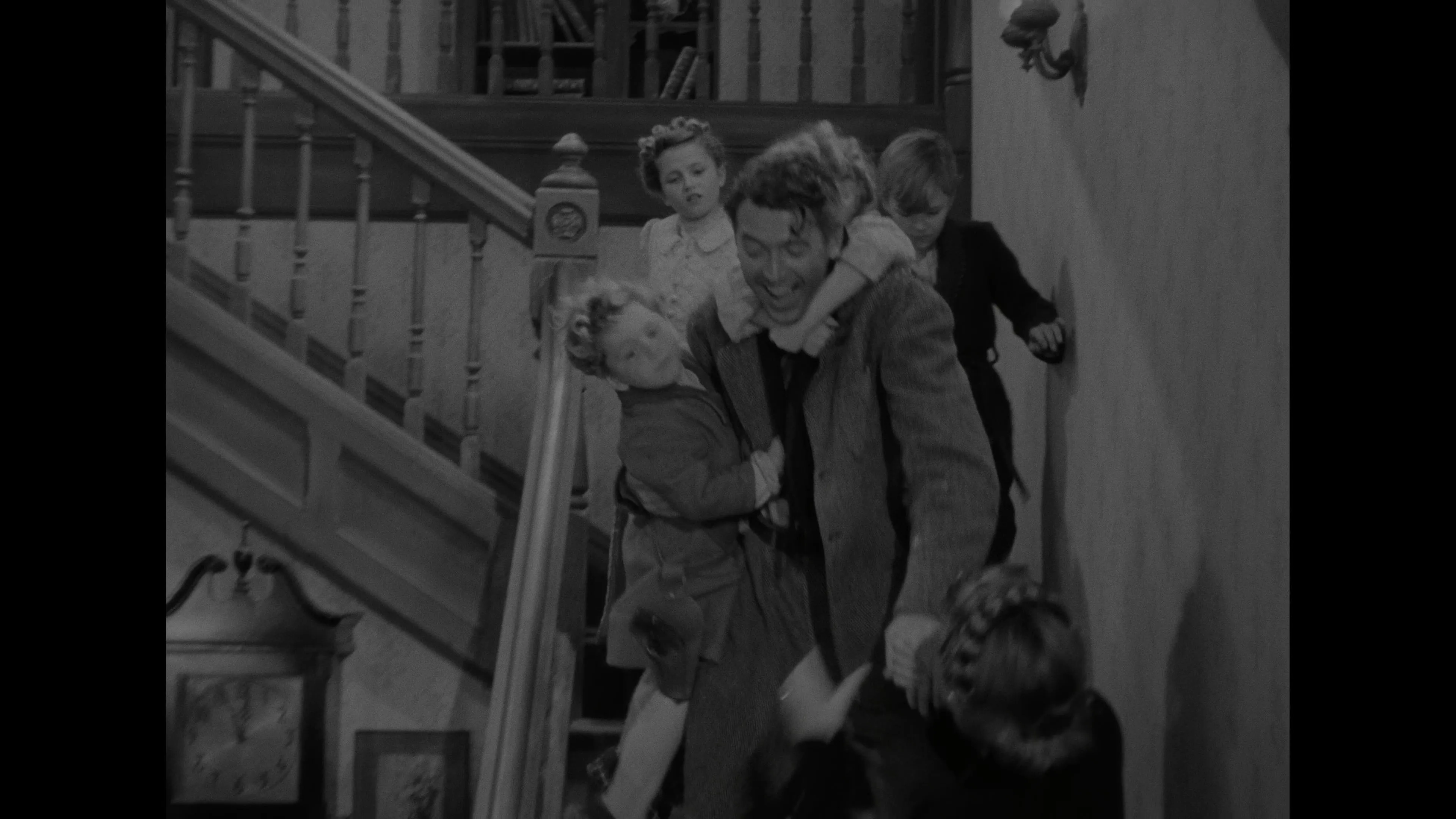 James Stewart, Donna Reed, Carol Coombs, Karolyn Grimes, Jimmy Hawkins, and Larry Simms in It's a Wonderful Life (1946)