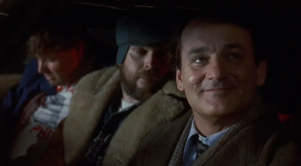 Bill Murray, Rick Ducommun, and Rick Overton in Groundhog Day (1993)