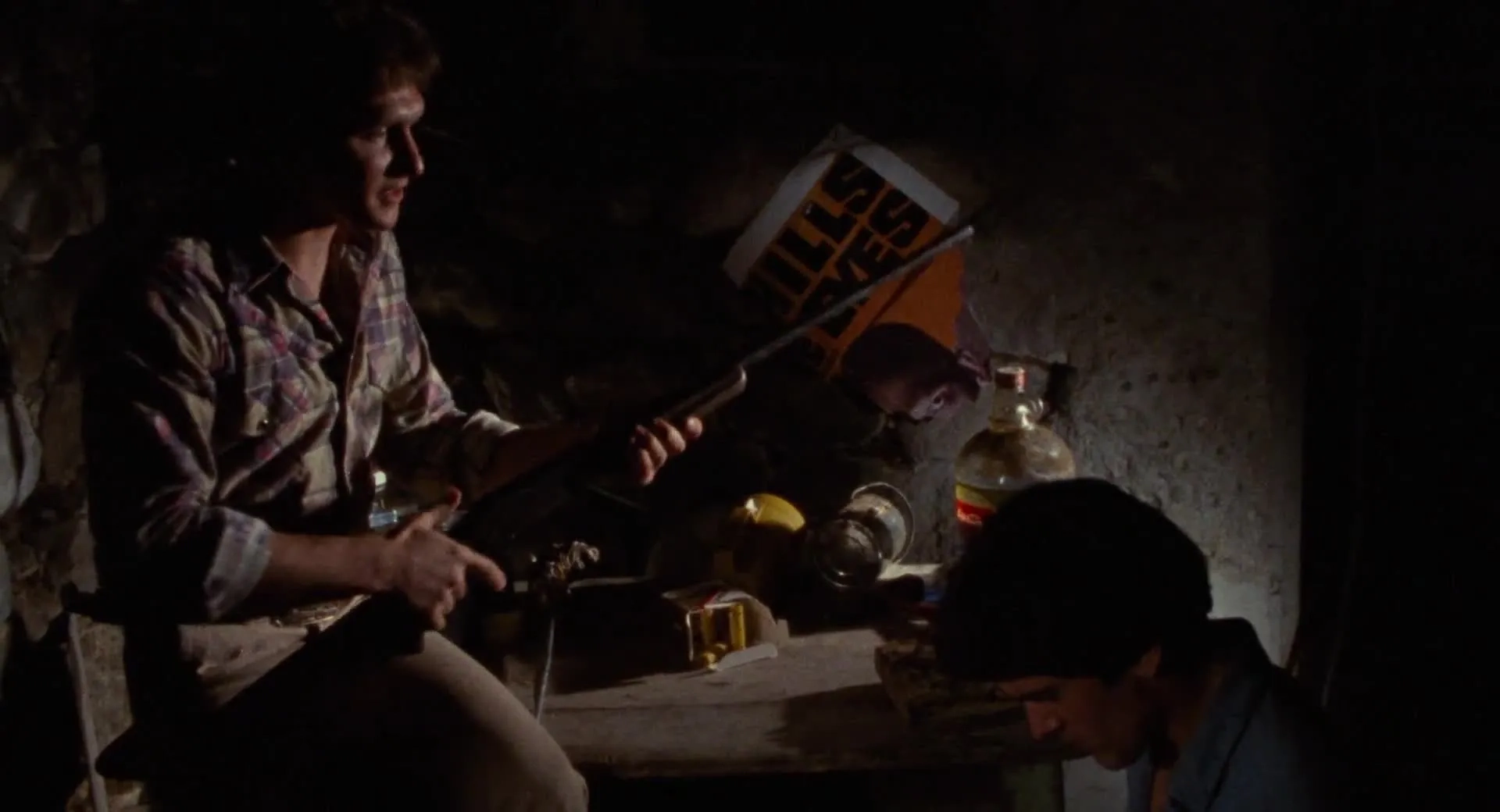 Bruce Campbell and Richard DeManincor in The Evil Dead (1981)