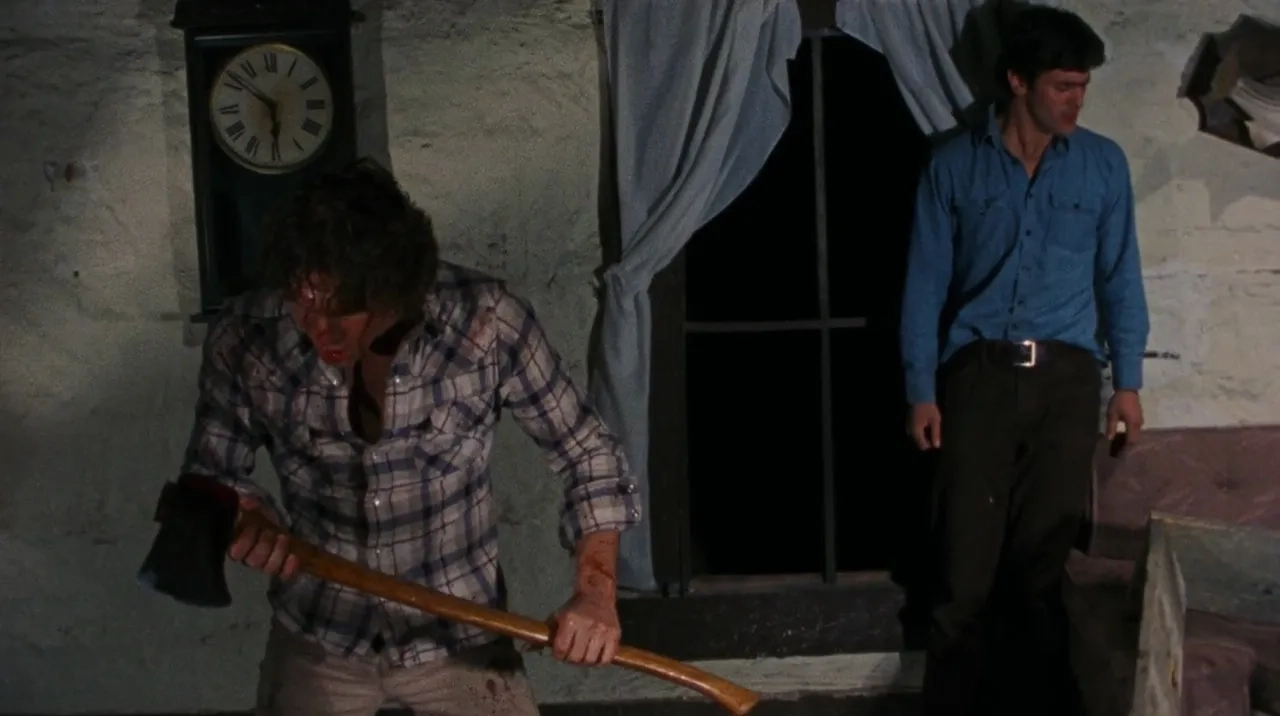 Bruce Campbell and Richard DeManincor in The Evil Dead (1981)