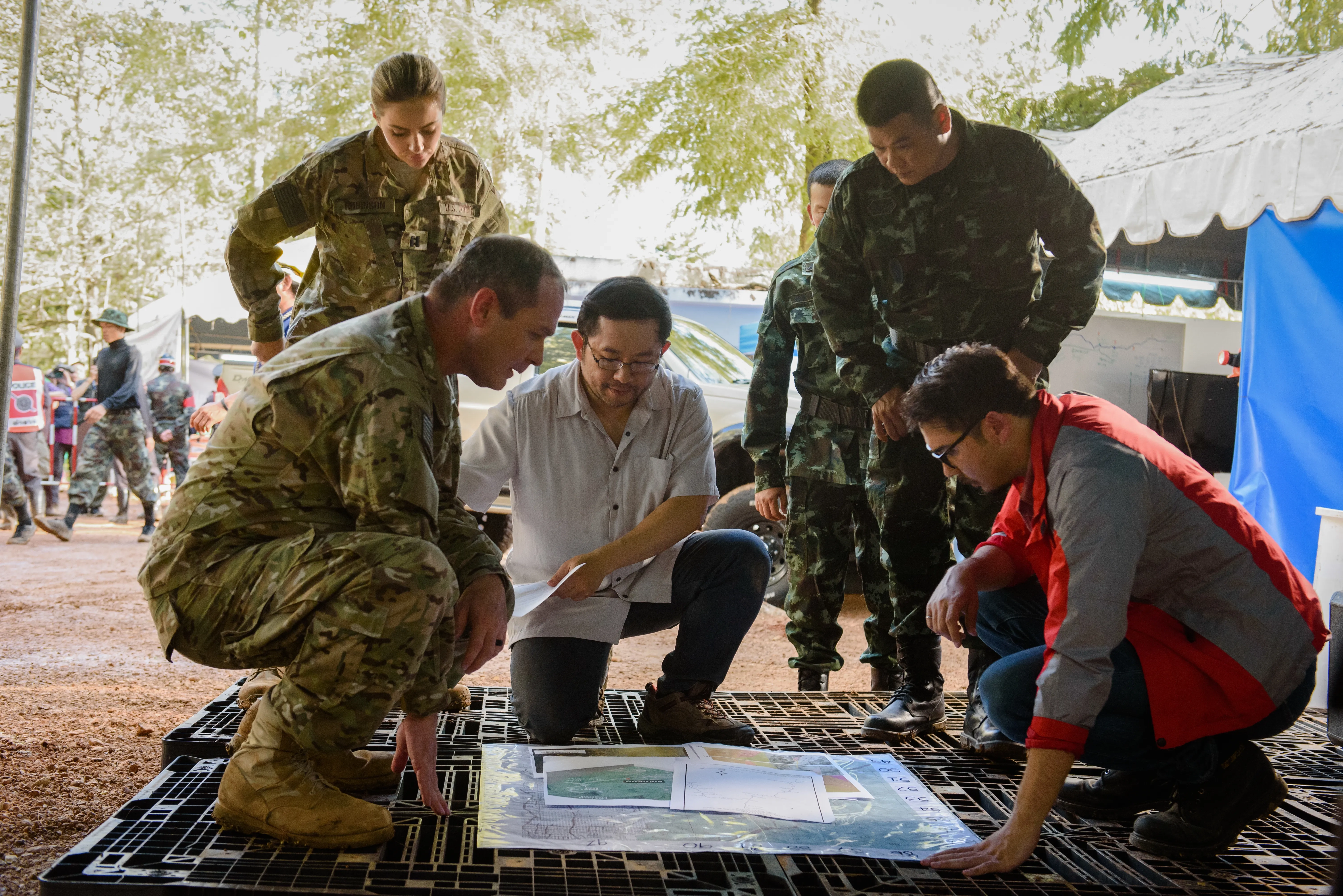 Grace Robinson, Burin Nakcharoen, Michael S. New, and James Edward Holley in The Cave (2019)