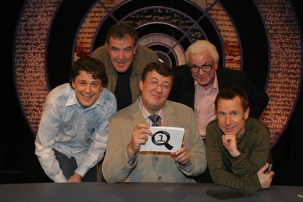 Stephen Fry, Jeremy Clarkson, Barry Cryer, Alan Davies, and Jeremy Hardy in QI (2003)