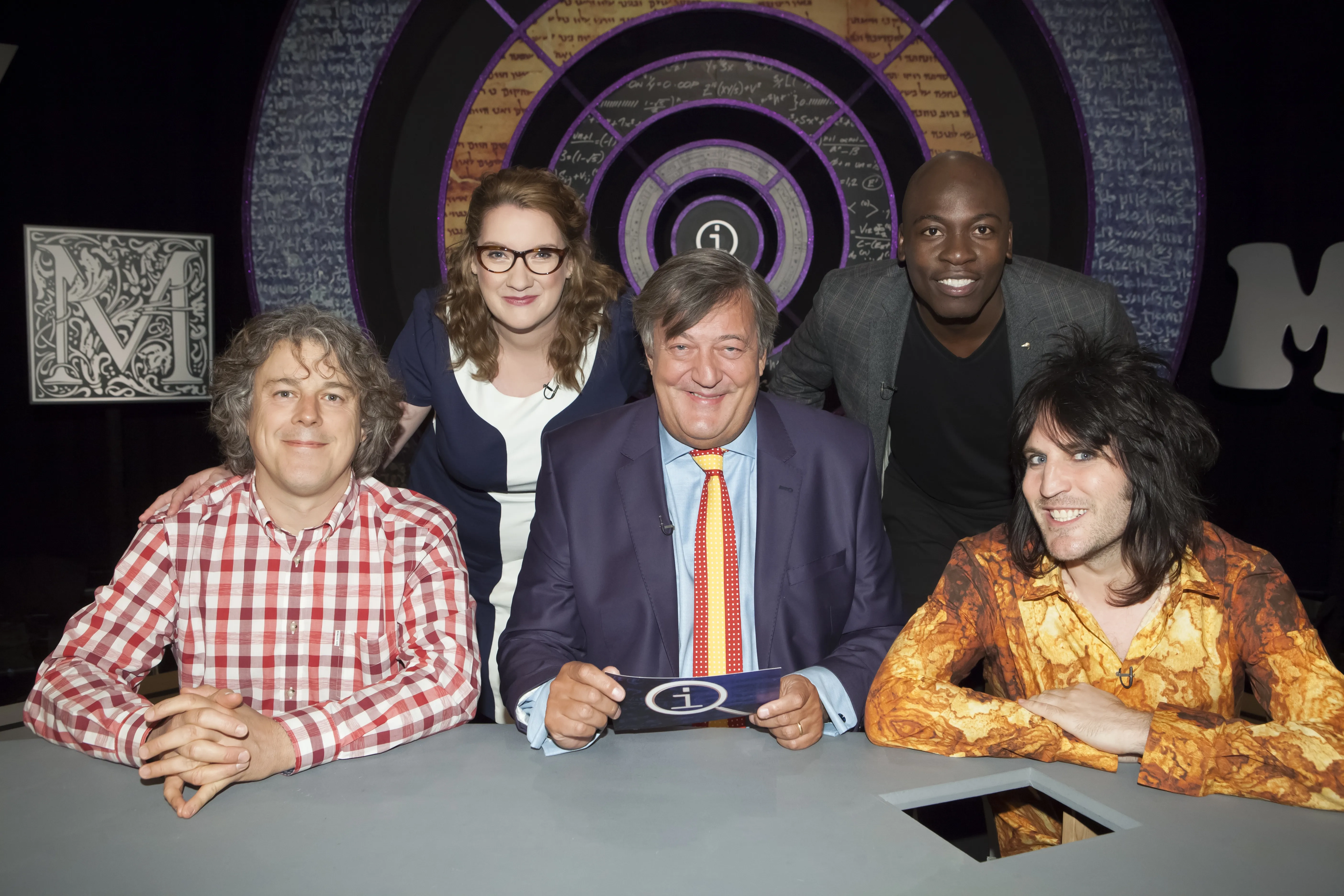 Stephen Fry, Alan Davies, Noel Fielding, Sarah Millican, and Eddie Kadi in QI (2003)